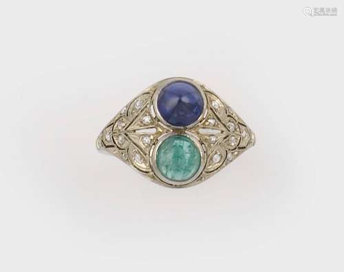 An emerald and sapphire ring