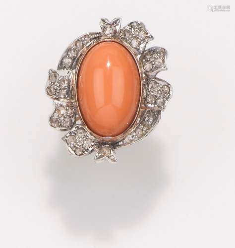 A coral and diamond ring