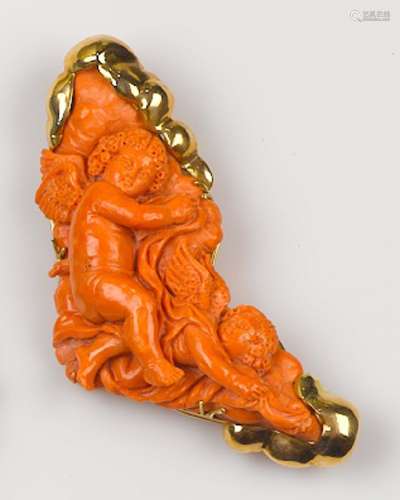 A carved coral brooch