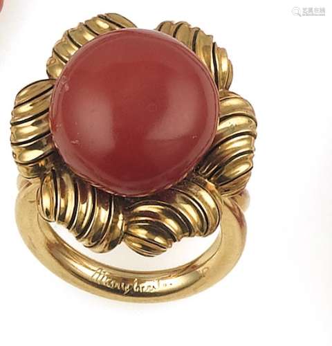 A gold and coral ring