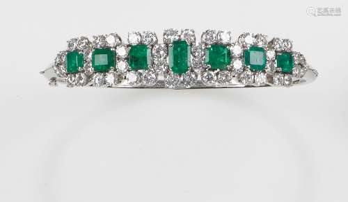 An emerald and diamond bangle