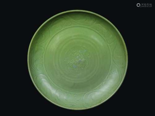 A Celadon porcelain dish with naturalistic decoration, China, Ming Dynasty, 16th century