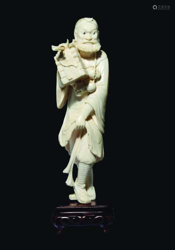 A carved ivory figure of wayfarer with skulls necklace, China, early 20th century