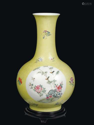 A yellow-ground porcelain vase with floral decoration within reserves, China, Qing Dynasty, early 20th century