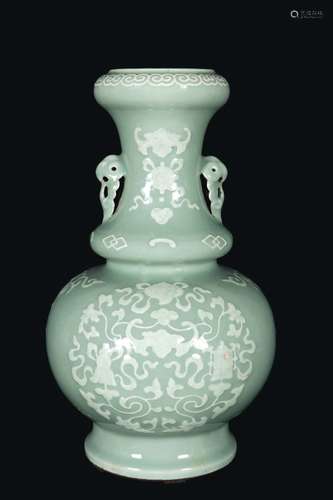 A green-ground porcelain vase with naturalistic white decoration of bats, China, Qing Dynasty, 19th century