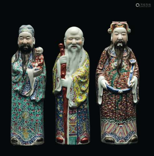 Three polychrome enamelled porcelain figures of wise men, China, Qing Dynasty, late 19th century