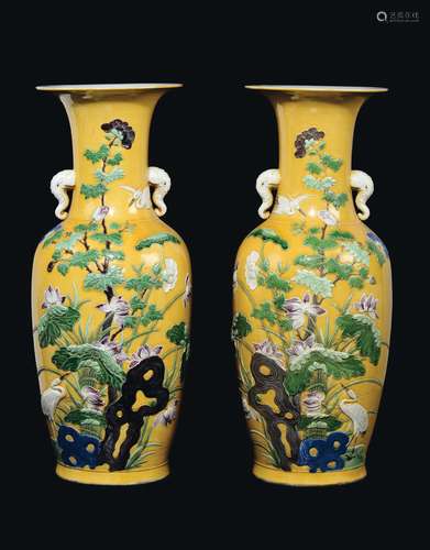 A pair of yellow-ground porcelain vase with elephant-head handles, China, Qing Dynasty, 19th century