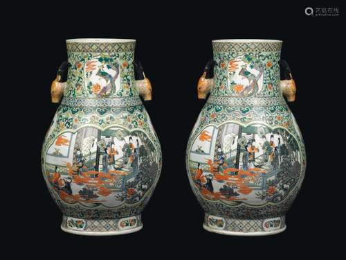 A pair of polychrome enamelled porcelain vases with deer-handles depicting court life scenes within reserves, China, Republic, 20th century