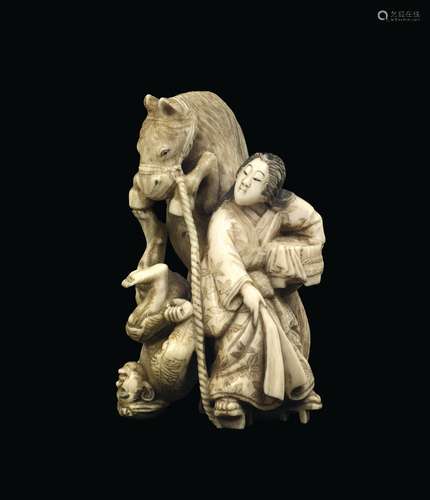 A carved ivory group with two countrymen and a horse, Japan, Meiji Period, 19th century