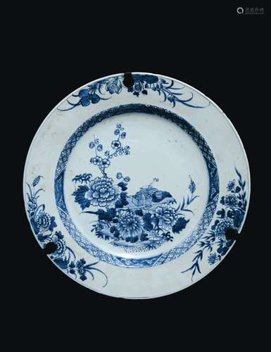 A blue and white porcelain dish with naturalistic decoration, China, Qing Dynasty, 18th century