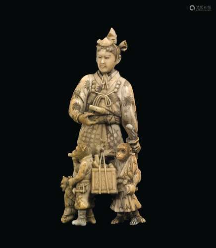 A carved ivory dignitary with monkeys, Japan, Meiji Period, 19th century