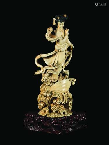 A carved ivory figure of Guanyin on a shell, China, early 20th century