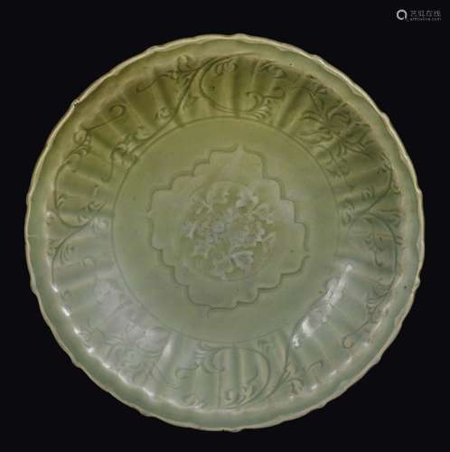 A Celadon porcelain dish with fluted decoration, China, Yuan Dynasty (1279-1368)