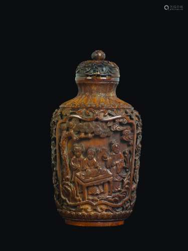 A large stained ivory snuff bottle with Guanyin within reserves, China, Qing Dynasty, 19th century