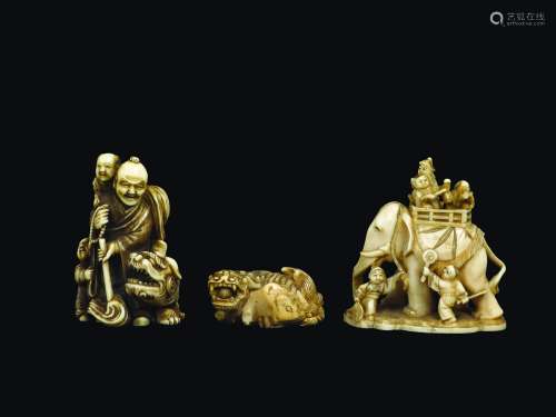 Three carved ivory group with children, a wise man with stick, Pho dogs and elephant, Japan, Meiji Period, 19th century
