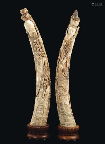 A piar of large carved ivory figures, Guanyin and Shoulao, China, early 20th century