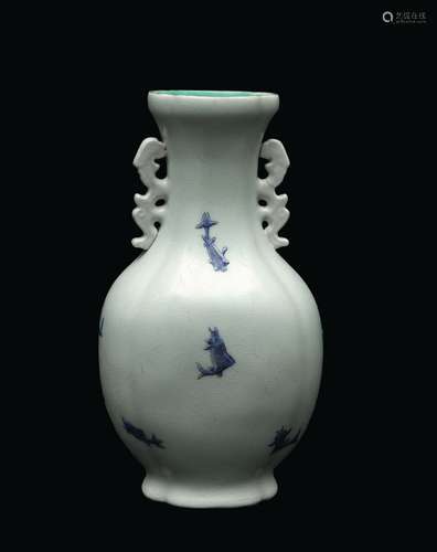 A porcelain double handled vase depicting blue fish, China, Qing Dynasty, Daoguang Mark and of the Period (1821-1850)