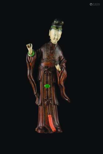 An homu and ivory figure of Guanyin with coral and semi-precious stones inlays, China, Qing Dynasty, late 19th century