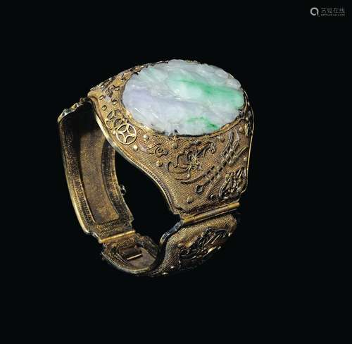 A bracelet with a jadeite plaque with naturalistic decoration, China, Qing Dynasty, 19th century