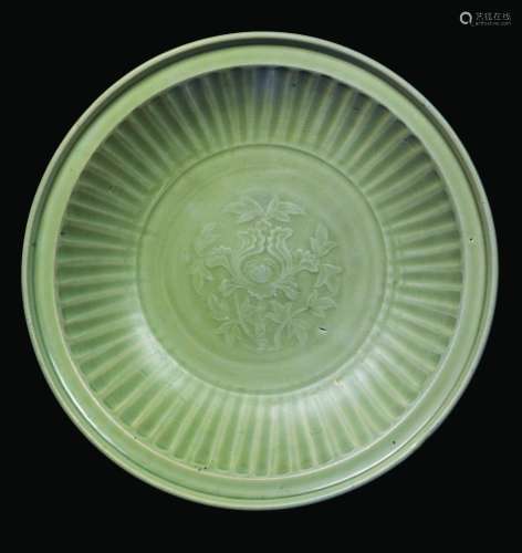 A Celadon porcelain dish with fluted lotus flower, China, Ming Dynasty, 17th century