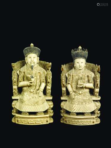 A pair of carved ivory Emperors on throne, China, early 20th century
