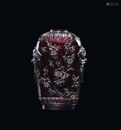 A red amber snuff bottle with flowers in relief, China, Qing Dynasty, 19th century