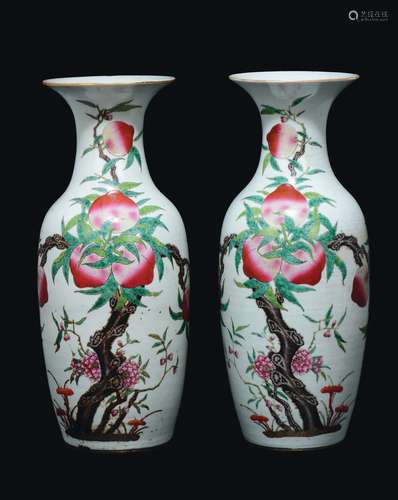 A pair of polychrome enamelled porcelain vases with nine peaches decoration, China, Qing Dynasty, 19th century