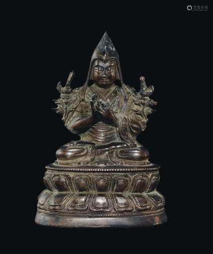 A bronze figure of Tsong kha pa on a double lotus flower, Tibet, 18th century