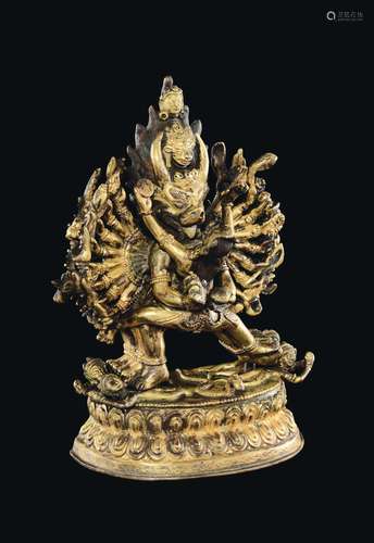 A gilt bronze figure of Vajrabhairava in Yab Yum with wife on a double lotus flower, Tibet, 19th century