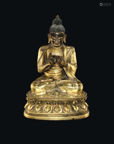 A gilt bronze figure of Sakyamuni on a double lotus flower, China, Ming Dynasty, 17th century