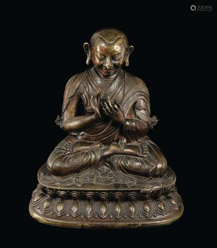 A large and important semi-gilt bronze figure of Lama seated on a double lotus flower, China, Qing Dynasty, Qianlong Period (1736-1795)