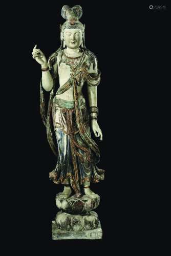 A large and important carved polychrome and gilt wood figure of standing Bodhisattva on a lotus flower, China, Ming Dynasty, 15th century