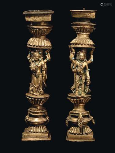 A rare pair of gilt bronze ornament with semi-precious stones inlays, Densatil monastery taste, Tibet, 15th century