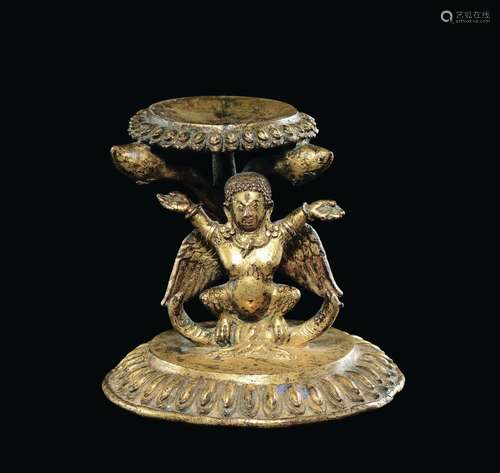 A rare gilt bronze lift, Tibet, 14th century