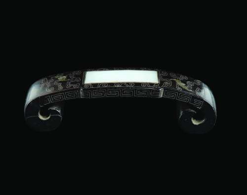 A zitan wrist-rest with white jade plaque with silver inlays between bats, China, Qing Dynasty, 18th century