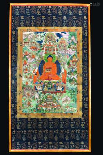 A framed gilt-highlighted silk tanka with a central figure of Buddha, Tibet, 18th century