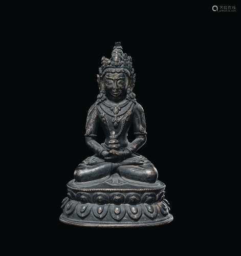 A bronze figure of Amitayus with cup on a double lotus flower, China, Ming Dynasty, 17th century