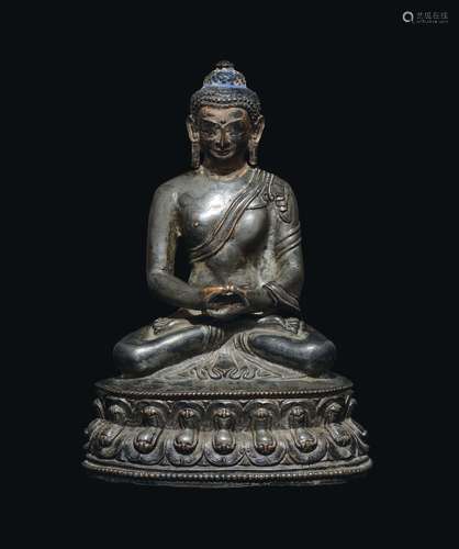 A silver-bronze figure of Sakyamuni Buddha on a double lotus flower, China, Ming Dynasty, 16th century