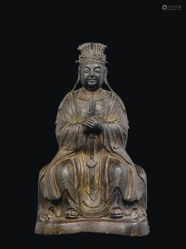 A semi-gilt bronze figure of seated dignitary, China, Ming Dynasty, 17th century