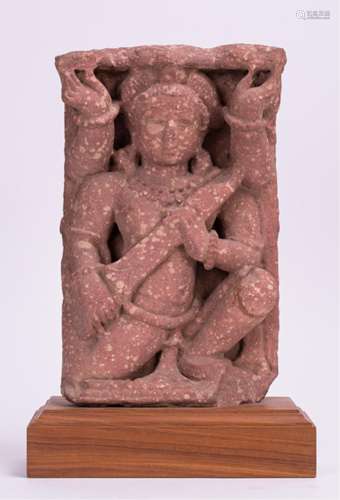 AN INDIAN CARVED SANDSTONE FIGURE