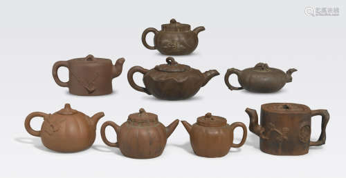 A group of eight Yixing pottery teapots