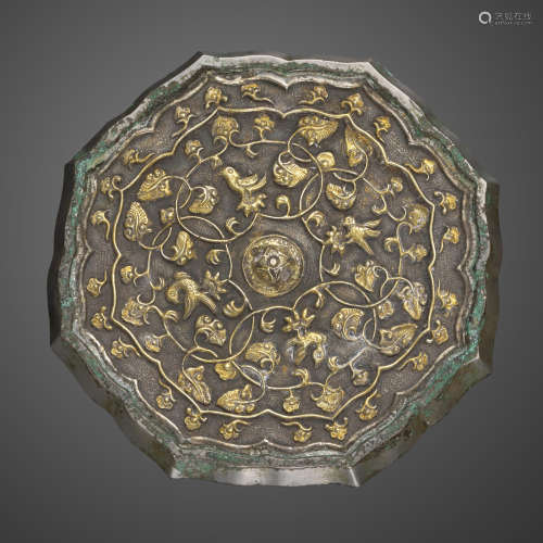 A lobed rim parcel-gilt bronze mirror Tang dynasty