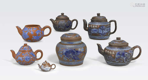 A group of seven blue enamel decorated yixing pottery vessels