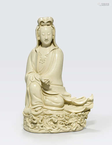 A cream-glazed figure of Guanyin