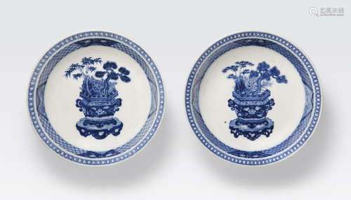 A pair of blue and white soft paste porcelain shallow bowls Chenghua marks, 18th century