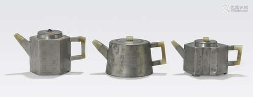 A group of three pewter encased Yixing teapots Qing dynasty