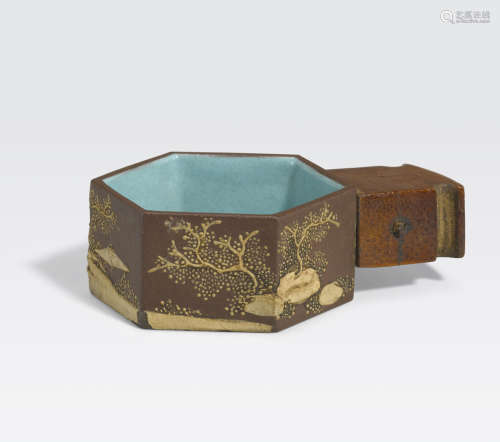 A miniature hexagonal slip-decorated Yixing pottery bird feeder