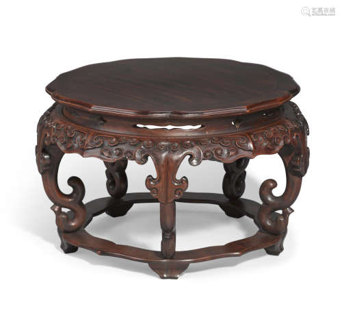 A well-carved petallate top huanghuali stand 19th century