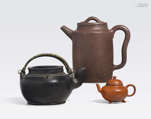 A group of three yixing teapots