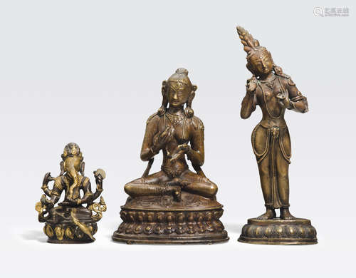 A group of three copper alloy figures